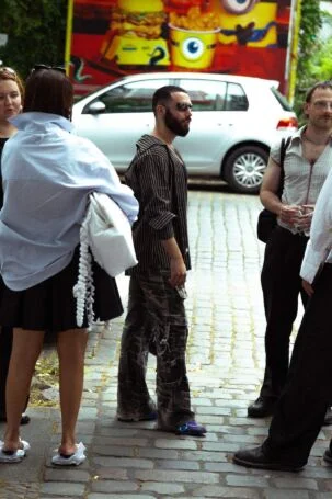1/27 | Taskin Goec Spring 2027 Street Style | Photo: Tim Kestel | Courtesy of Berlin Fashion Week Taskin Goec Spring 2027 Street Style | Photo: Tim Kestel | Courtesy of Berlin Fashion Week